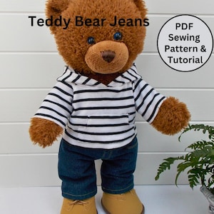 May include: A brown teddy bear wearing a white and black striped hooded shirt and blue jeans. The text "Teddy Bear Jeans" is above the bear and "PDF Sewing Pattern & Tutorial" is in a circle to the right of the bear.
