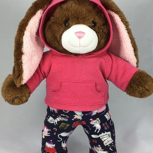 Build a bear teddy bear wearing a pink hoodie and multicoloured leggings