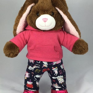 Build a bear teddy bear wearing a pink hoodie and multicoloured leggings