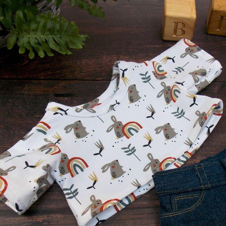 Teddy Bear T-shirt on wooden surface. The teddy bear t-shirt has been made from a sewing pattern by Best Dressed Bears