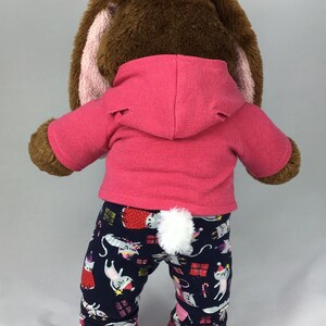Build a bear teddy bear wearing a pink hoodie and multicoloured leggings