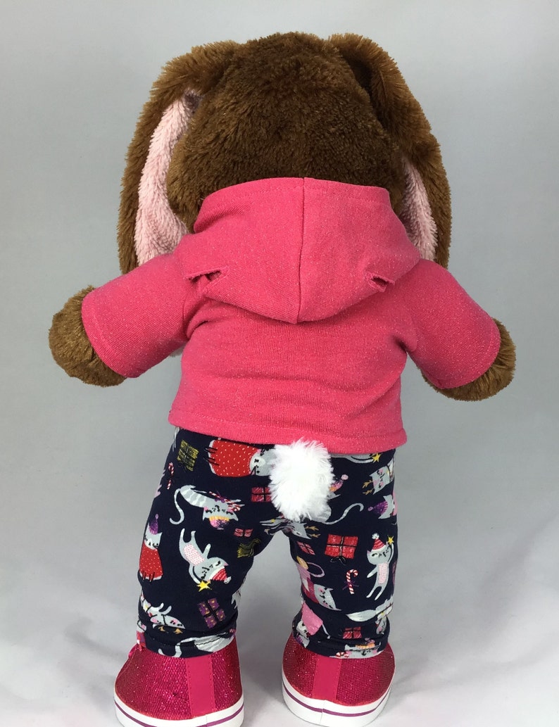 Build a bear teddy bear wearing a pink hoodie and multicoloured leggings