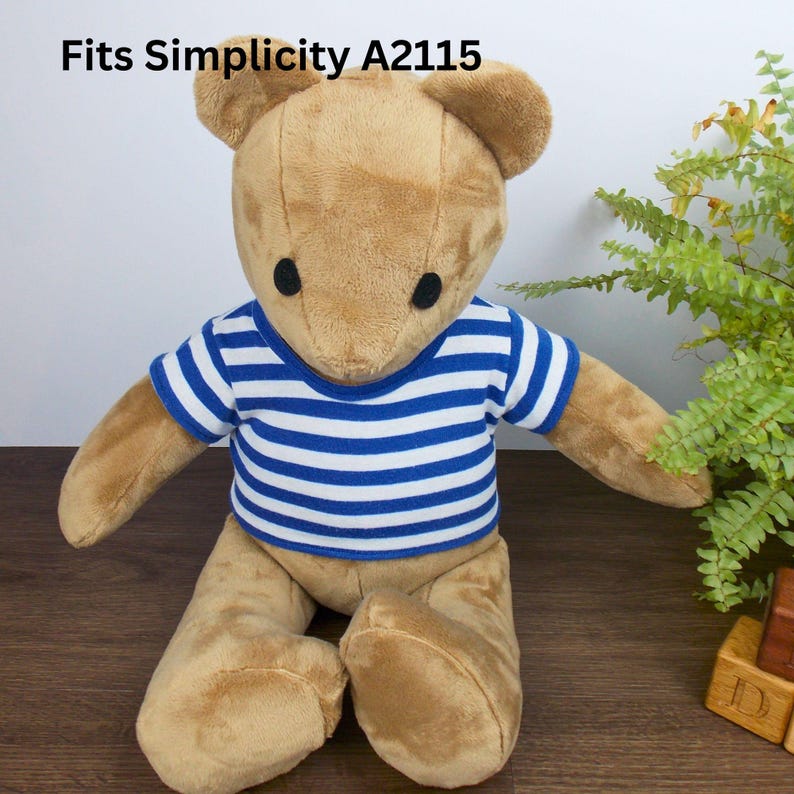 Brown Simplicity memory teddy bear wearing a blue & white striped t-shirt. The text on the image reads 'Fits Simplicity A2115' refers to the fact that the t-shirt the teddy is wearing is made with a sewing pattern from Best Dressed Bears