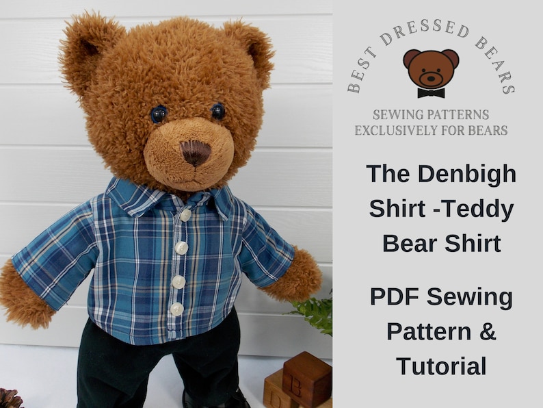 Build a bear teddy bear wearing a blue checked shirt and black trousers.