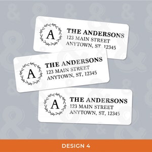 May include: Three white address labels with rounded corners. Each label features a black initial "A" inside a laurel wreath, the name "THE ANDERSONS", address, and the text "DESIGN 4".