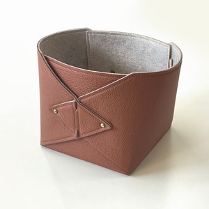 May include: A rustic wooden sign with the text "Welcome to our home" in a handwritten style. The sign features a distressed finish and a simple, inviting design, perfect for a front porch or entryway.