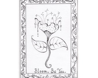 May include: Black and white pen and ink drawing of a stylized flower with a dotted petal design and two large leaves. The drawing is framed with a decorative border of leaves and vines. The text "Bloom. Be You." is written at the bottom.