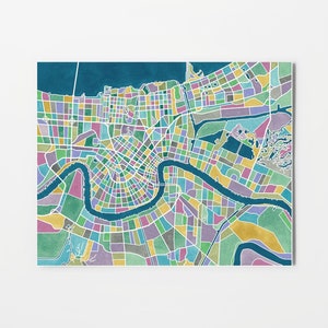 May include: A colorful map of New Orleans, Louisiana, with a teal blue river winding through the city. The map is divided into small squares, each filled with a different color, creating a patchwork effect.
