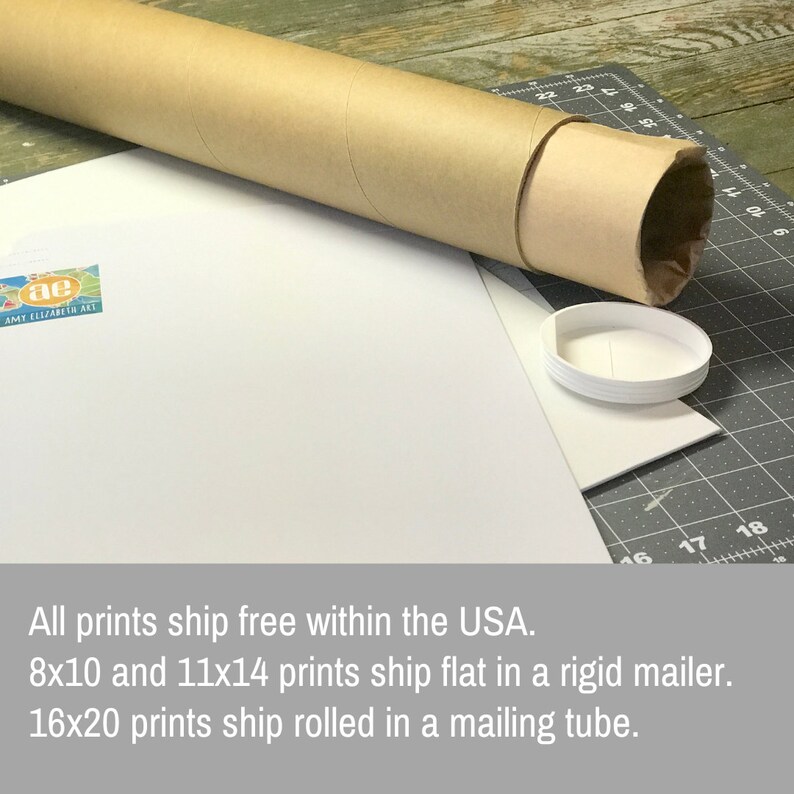 May include: A brown mailing tube with a white cap, used for shipping prints. The text on the white surface reads: "All prints ship free within the USA. 8x10 and 11x14 prints ship flat in a rigid mailer. 16x20 prints ship rolled in a mailing tube."