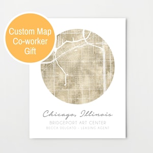 May include: A beige and white circular map of Chicago, Illinois with the text "Chicago, Illinois" and "Bridgeport Art Center" below the map. The text "Becca Delcato - Leasing Agent" is below the center text.
