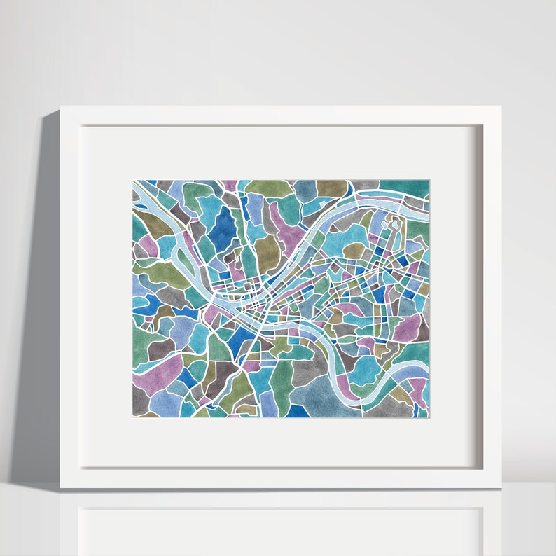 May include: A watercolor map of a city with a river winding through it. The map is in shades of blue, green, and purple.
