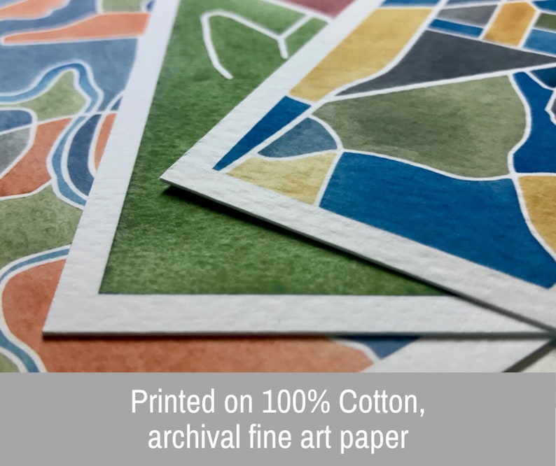 May include: Close-up of three watercolor prints on 100% cotton archival fine art paper. The prints feature abstract geometric patterns in shades of blue, green, yellow, and orange.