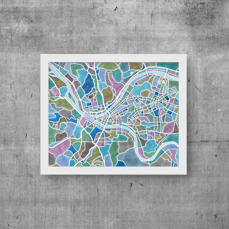 May include: A watercolor illustration of a city map with a river winding through it. The map is filled with different shades of blue, green, and purple.