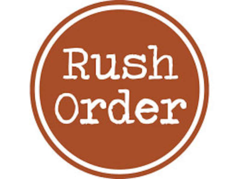May include: A brown circle with a white outline and the text "Rush Order" in white typewriter font.
