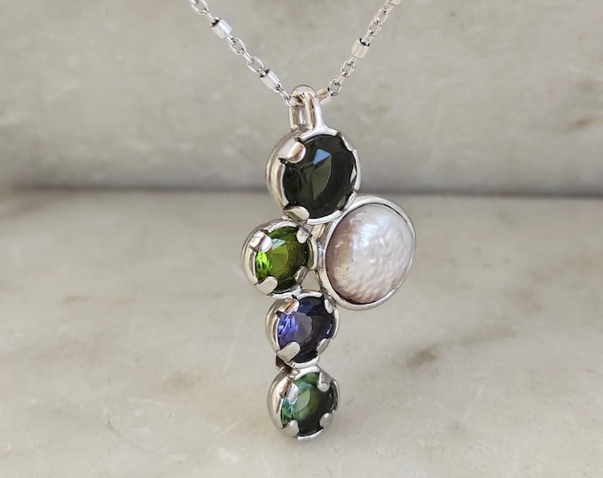 Silver pendant with purple, green and freshwater glass pastes