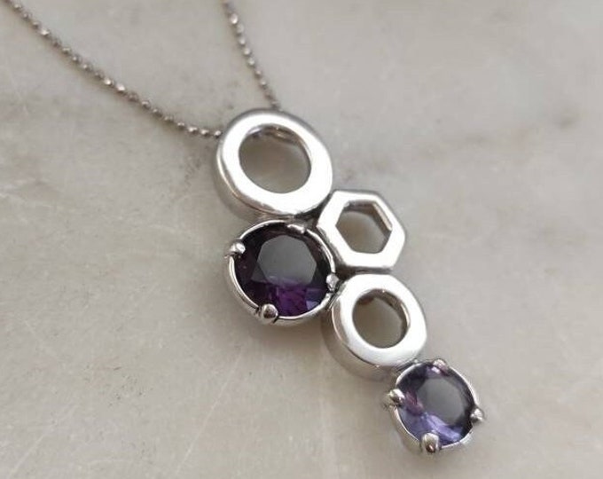 Silver pendant with purple glass paste