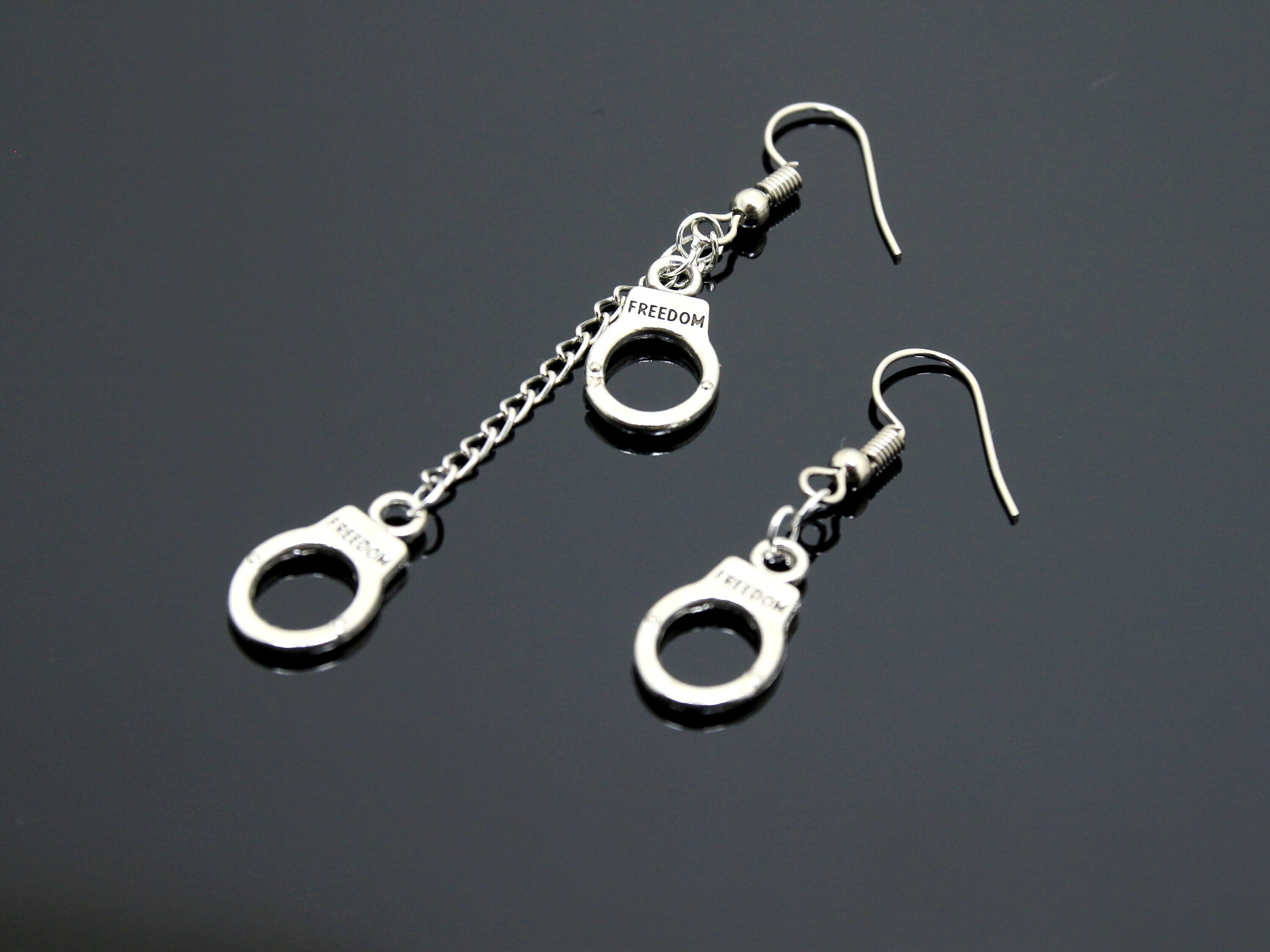 Freedom handcuff silver earrings
