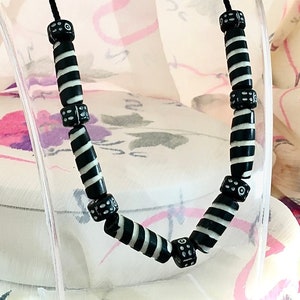 Necklace with exquisitely carved dyed horn and etched rhondels in a Black & White motif