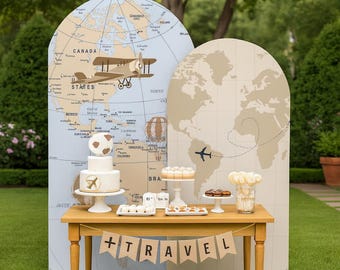 May include: A wooden table displays a travel-themed party setup. A banner reads "+TRAVEL". The backdrop features world maps and an airplane graphic. A cake, cupcakes, and other treats are arranged on the table, creating a festive atmosphere.
