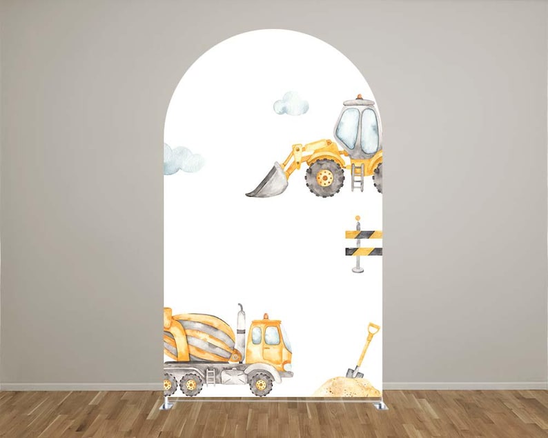 May include: A white arch-shaped backdrop featuring watercolor illustrations of construction vehicles. A yellow front-end loader and a cement mixer truck are depicted, along with a shovel, sand, and construction barriers. The backdrop is suitable for a construction-themed party.