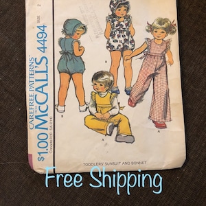 May include: Vintage McCall's sewing pattern for toddlers' sunsuit and bonnet. The pattern shows three different styles of clothing, including a gingham sunsuit, a floral sunsuit, and a yellow sunsuit with a matching bonnet. The pattern number is 4494.