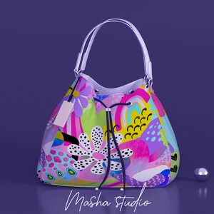 May include: A colorful, abstract patterned tote bag with white handles. The bag has a drawstring closure and a pink, green, blue, and yellow design.