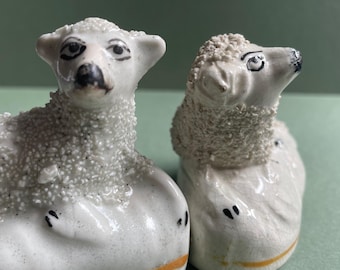 Pair of Antique Staffordshire Sheep with what looks like a passion for eyeliner