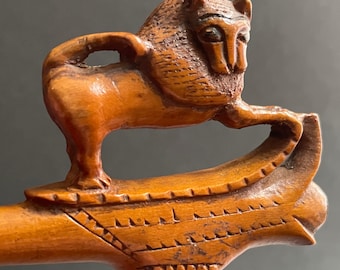 Antique Wooden Cigarette Holder upon which a Beautiful Carved Lion Stands Proudly