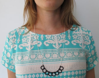 Long necklace with black seed beads and silver chain