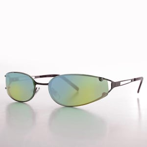 May include: Wraparound sunglasses featuring a thin, dark metallic frame and oval-shaped lenses with a reflective gradient finish that transitions from a cool blue at the top to a warm yellow-green hue at the bottom, complete with slim temples.