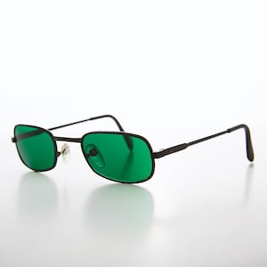 May include: Black metal frame sunglasses with green lenses.