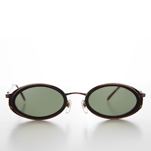 May include: Oval-shaped sunglasses with a dark brown metal frame and green lenses.