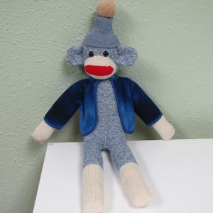 Red heel sock monkey, blue sock monkey, stuffed monkey from a blue red heel sock, classic sock monkey