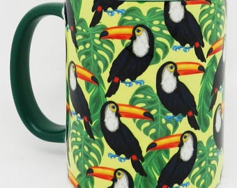 The Toucan Among The Leaves Mug with Glazed Green Handle and Inner