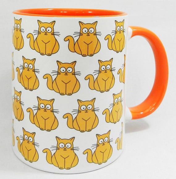 The Ginger Cat with the big eyes Mug with orange inner and handle