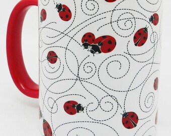 The Red Ladybird Trail Mug with red Glazed Handle and Inner