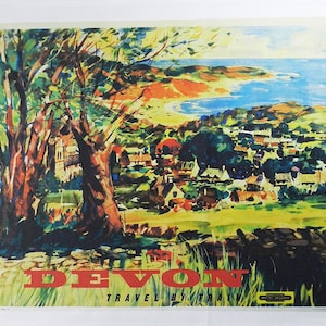 May include: Vintage travel poster for Devon, featuring a colorful landscape of a coastal town. The poster has the word "DEVON" in red letters and "TRAVEL BY TRAIN" below it. The image shows a vibrant scene with trees, buildings, and the sea.