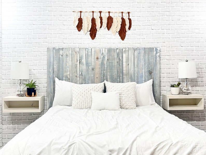 Floating wood panel headboard full size stained with a blue tint, colorwashed with white chalk paint. Paired with minimalist wooden floating nightstands in an antique white color.