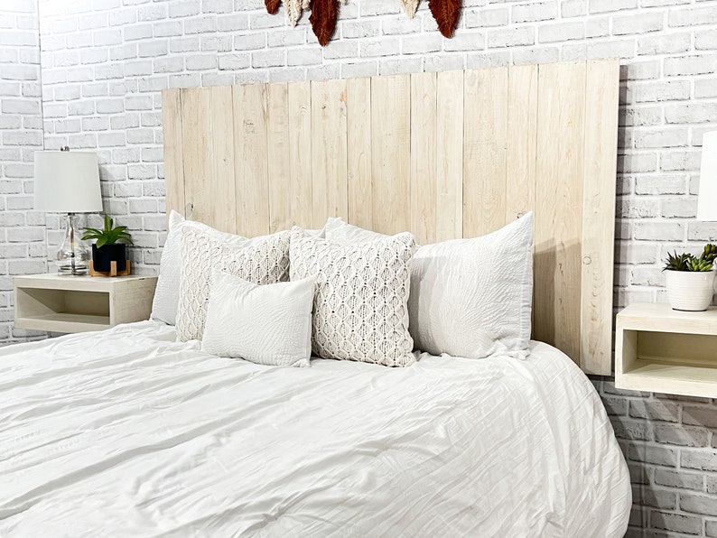 King-sized panel wood headboard, crafted from solid pine boards, showcases beautiful wood grain patterns accentuated by an antique white tint. This farmhouse white headboard is compatible with Sleep Number beds.