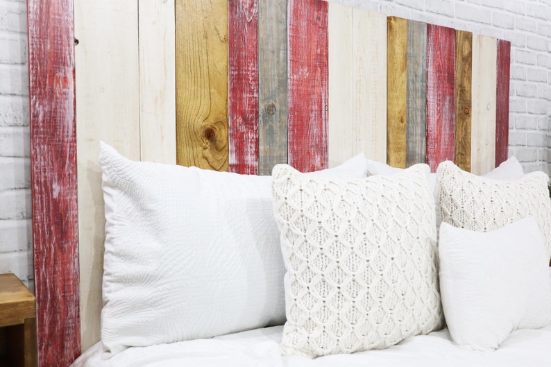 King size panel wood headboard for sleep number beds made with multi colored wood planks in red-wash, gray-wash, antique white weathered and distressed, and a golden brown wood stain exposing the beautiful wood grain patterns from the solid wood.