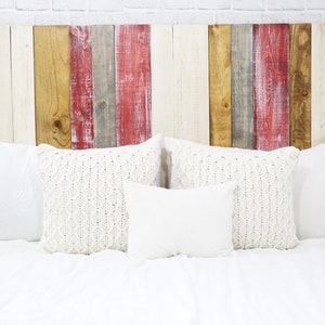 California King size adjustable bed headboard compatible, made of wood composed of multi-colored vertical wooden pallet boards in white, red, gray and brown colors in a modern rustic and country home decor style.