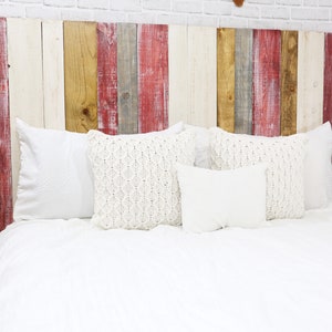 Twin Rustic wood headboard with vertical slats multicolored with redwash, golden brown, antique white and graywash colors, paired with a golden brown wood stain matching floating nightstands.