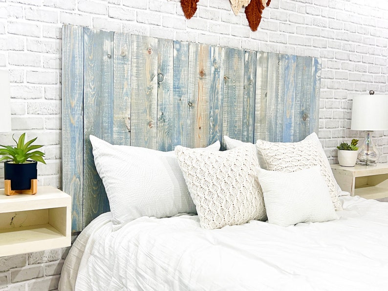 Wood twin headboard style with vertical slats in a blue powderwash finish, farmnhouse home decor style. Painted with a blue stain based, whitewash with milk paint and paired with weathered and distressed antique white floating nightstands style.