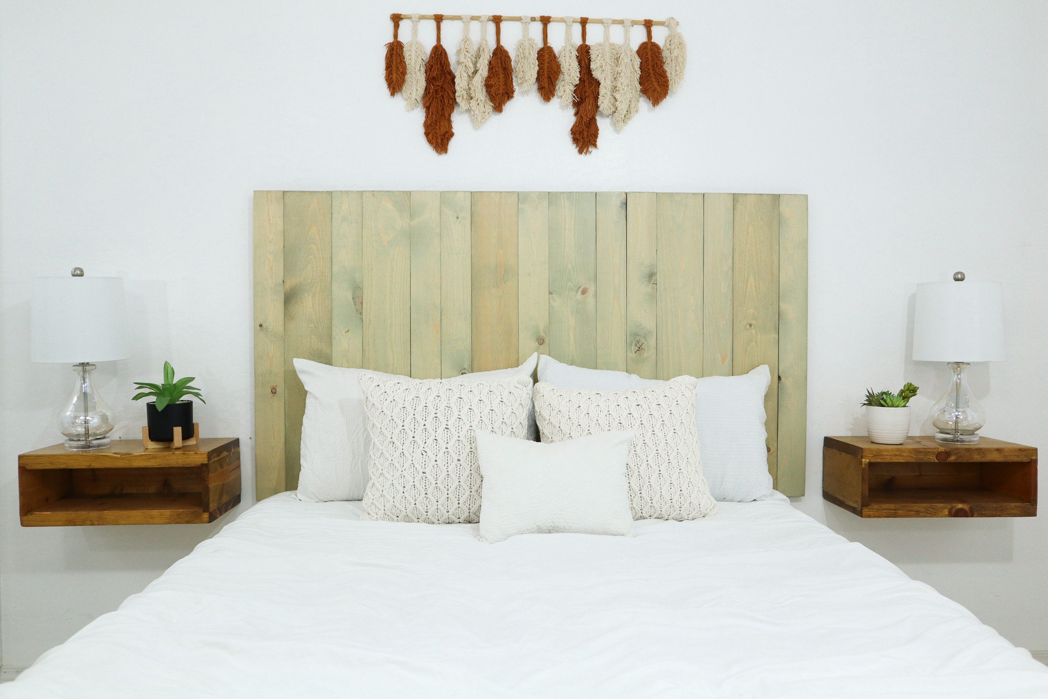 sage green cottage headboard with whitewashed pine background