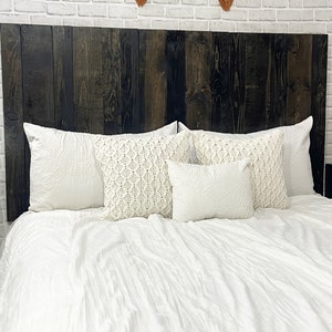 Modern Rustic wood twin headboard style with vertical slats in a black wood stain grain finish. Paired with matching floating nightstands in a black wood stain.