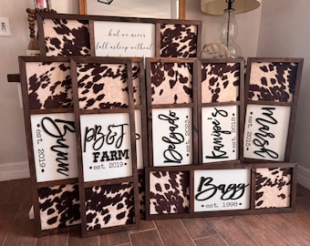 May include: A collection of eight wooden signs with cowhide print backgrounds and black lettering. The signs feature the names "Bunn", "PB&J Farm", "Delyado", "Kanipe's", "Marsh", and "Bagg" with their respective establishment dates.
