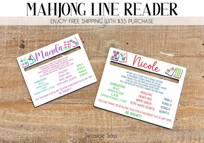 May include: Two white rectangular Mahjong line reader cards featuring personalized names Manda and Nicole in script font. Each card displays colorful Mahjong tile illustrations, game rules, and scoring categories in green, red, and blue text.