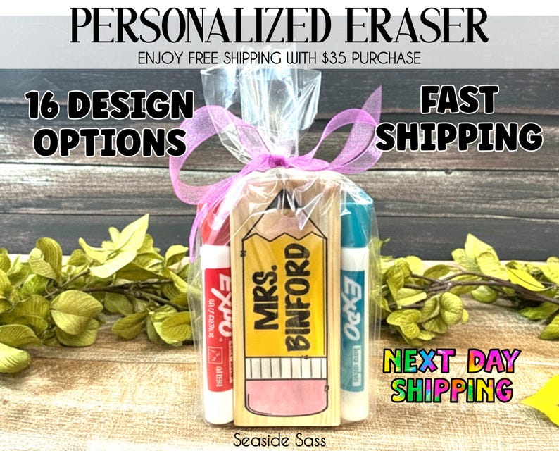 May include: A personalized eraser gift set featuring a wooden pencil-shaped eraser with "MRS. BINFORD" printed on it, accompanied by two Expo dry-erase markers. The set is wrapped in clear cellophane and tied with a pink ribbon. The text "16 DESIGN OPTIONS" is also visible.