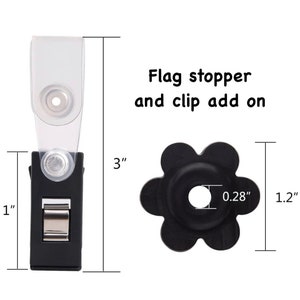 May include: Black plastic flag clip with a clear plastic strap, measuring 3 inches tall and 1 inch wide.  A black plastic flag stopper with a 0.28 inch diameter hole, measuring 1.2 inches tall.