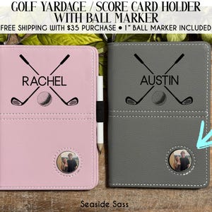 May include: Pink and gray golf yardage and score card holders with ball markers. Each holder features a golf ball and crossed golf clubs design, personalized with names. The pink holder is labeled "Rachel", and the gray holder is labeled "Austin".